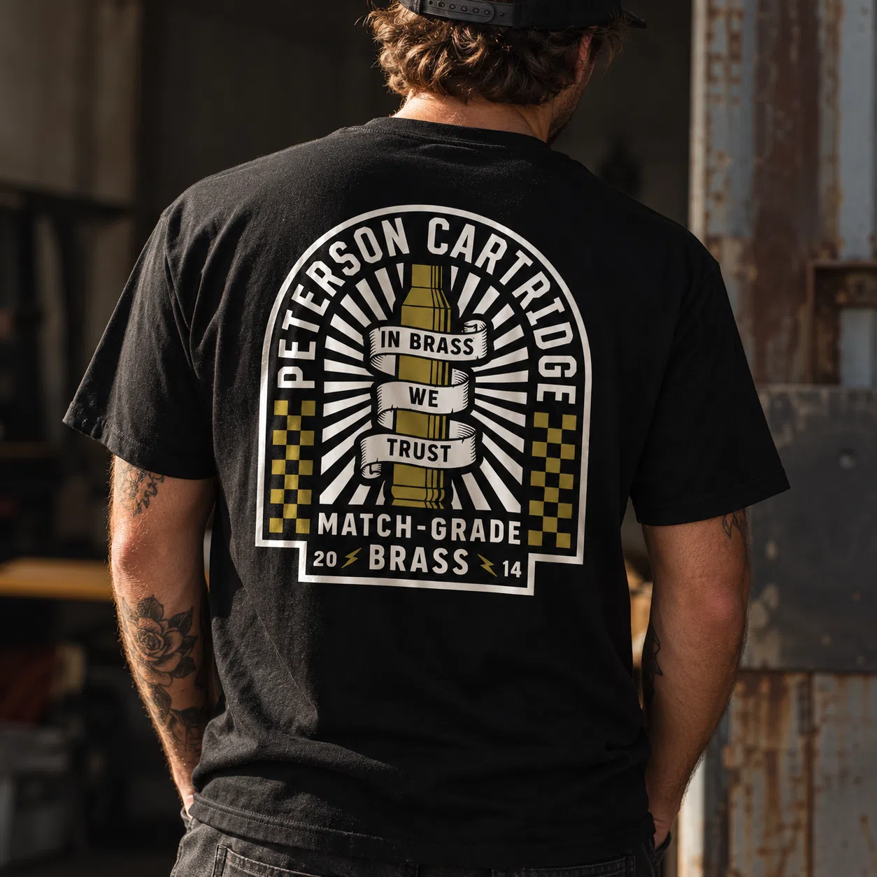 Peterson Cartridge black T-shirt back graphic on model